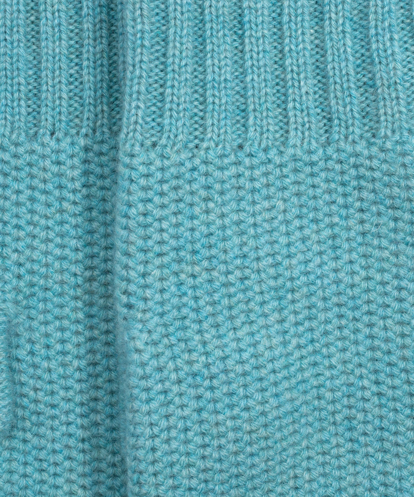 The Crosby Handwarmer in color spearmint/blue