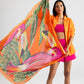 Two Toucans Square in color Tangerine held by model