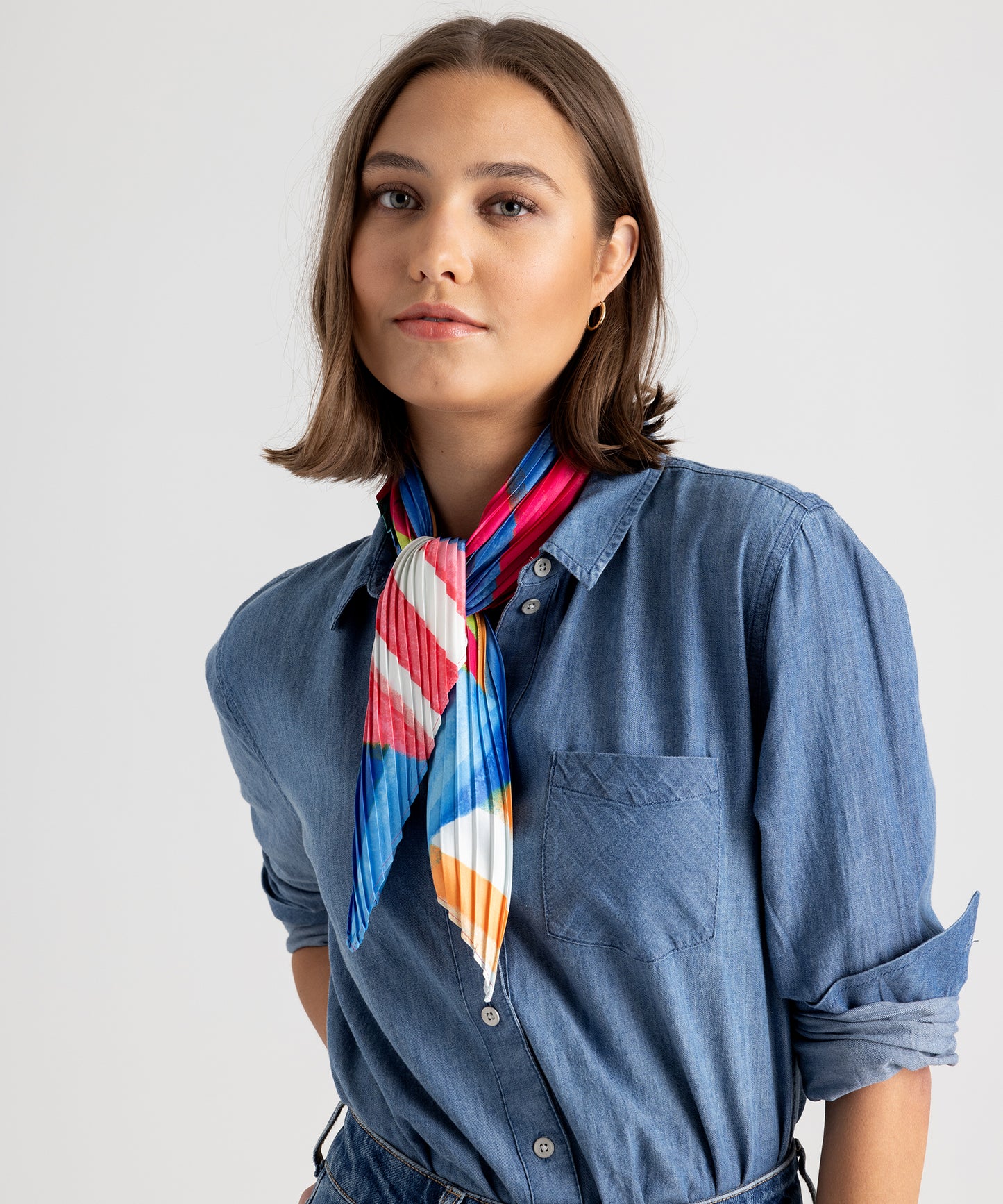 Model wearing the Mosaic Stripes Pleated Diamond in color Multi around her neck