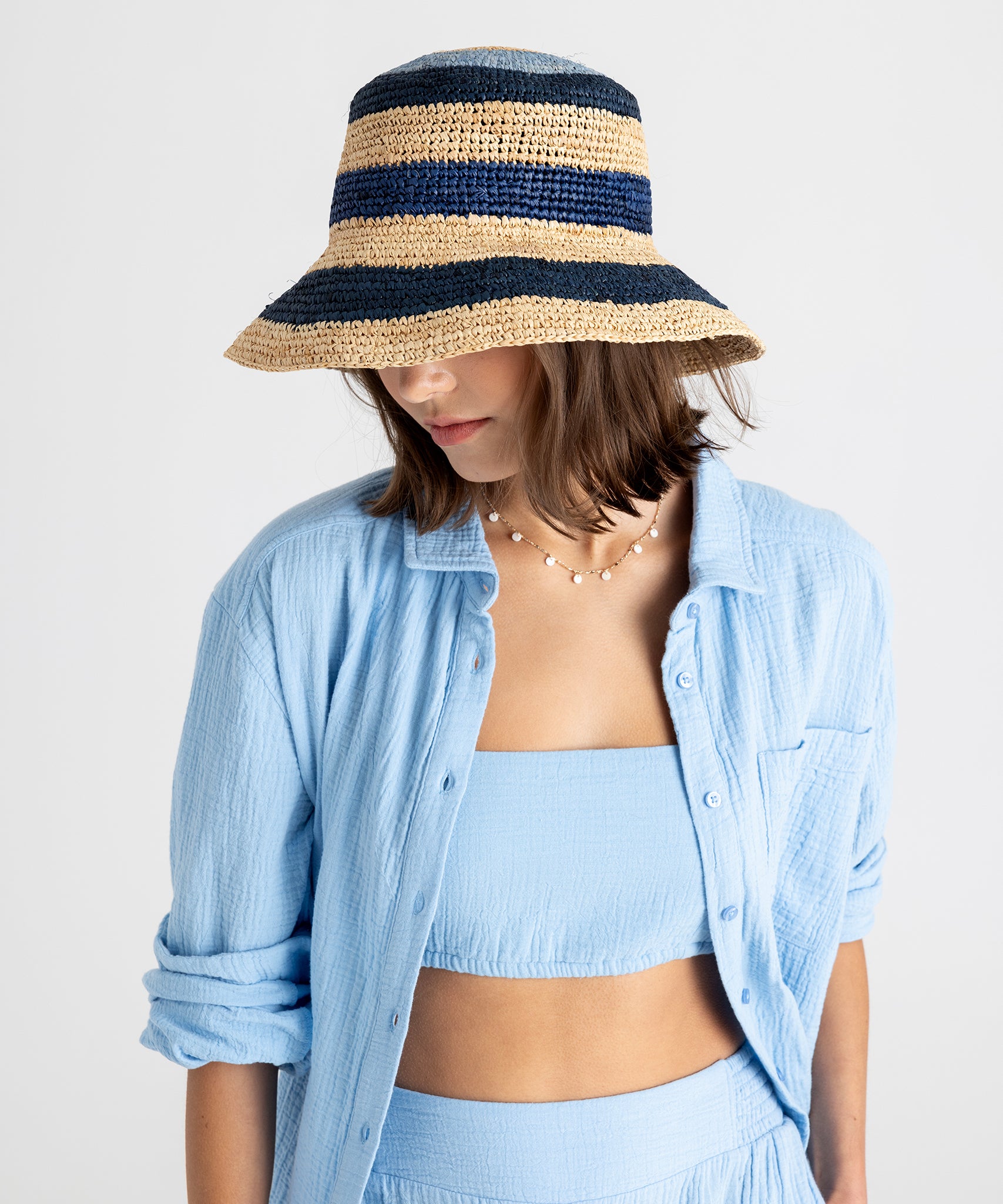 Tropic Stripe Hat in color Sea Blue on model