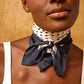 Navy blue square scarf with white polka dot pattern on a white background
