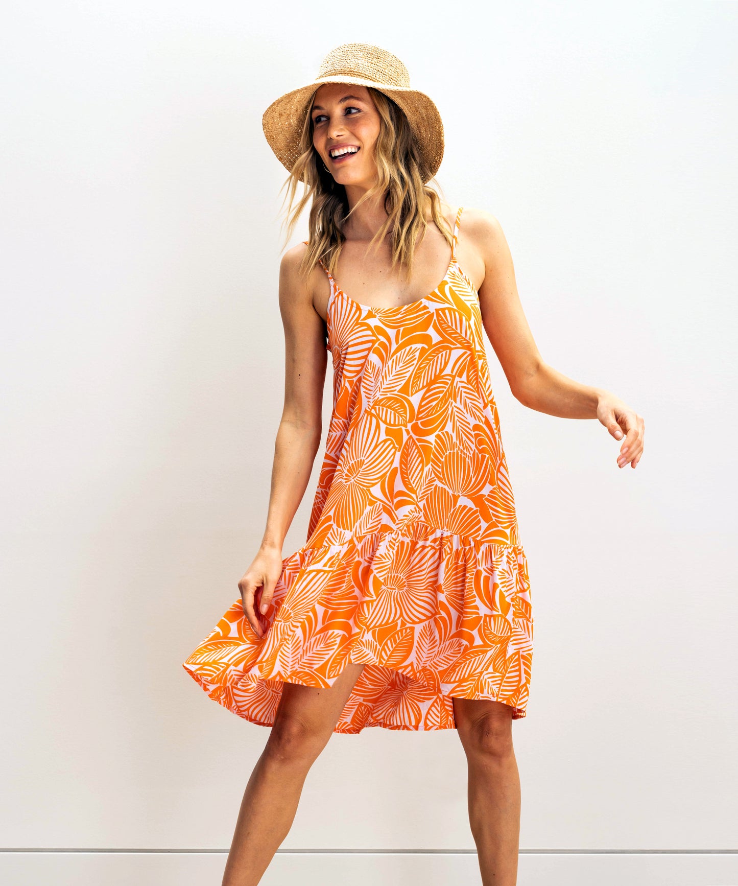 Woodcut Floral Tunic Dress in color Tangerine on a model