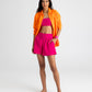 Supersoft Gauze Smocked Shorts in color hibiscus on model