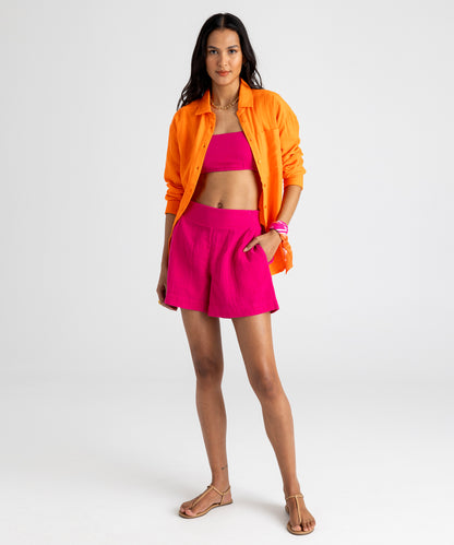 Supersoft Gauze Smocked Shorts in color hibiscus on model