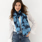 Moon Flower Sustainable Wrap in color Navy on a model