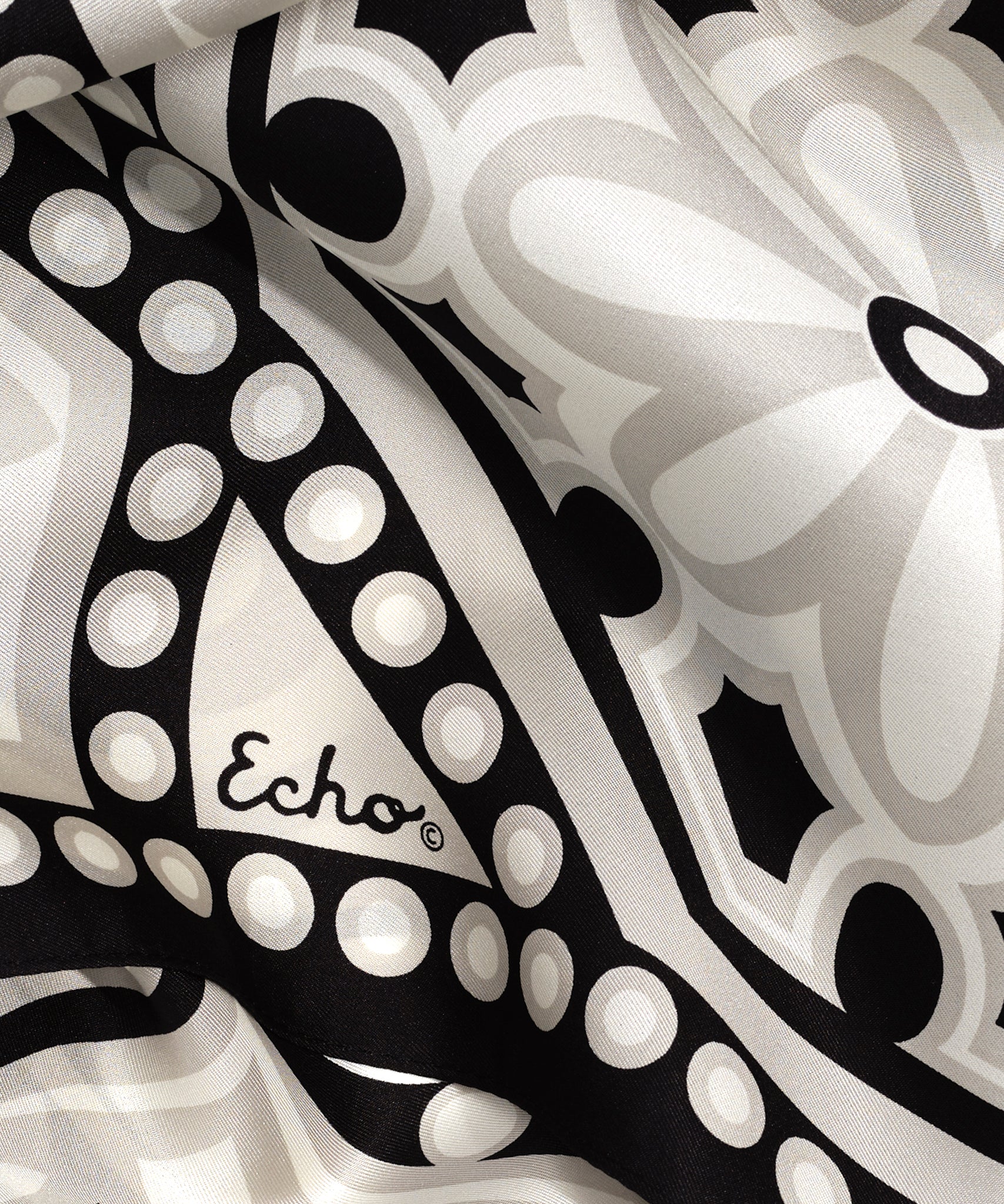 A close-up of The Marquee 35" Silk Square Scarf in Black