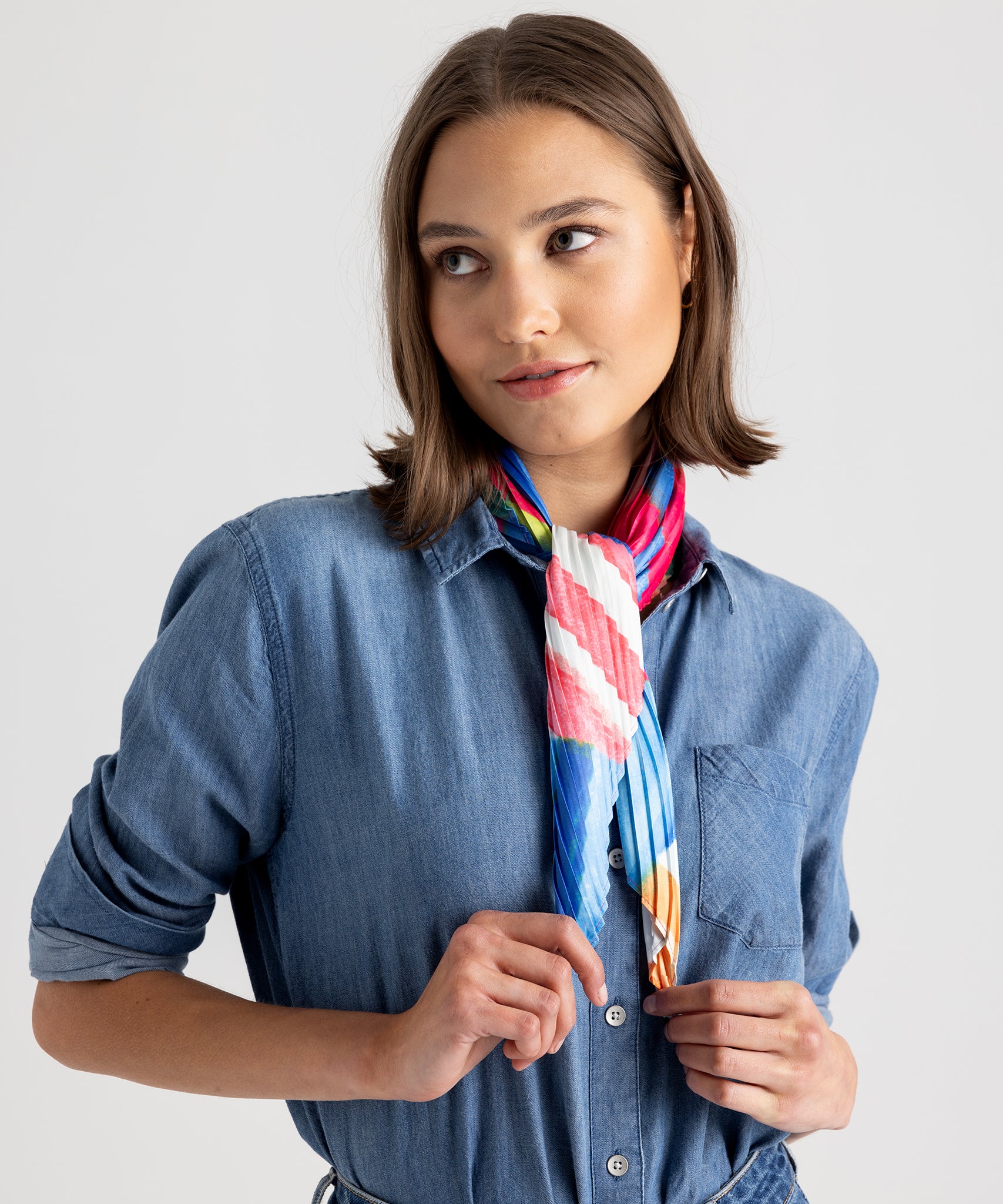 Model wearing the Mosaic Stripes Pleated Diamond in color Multi around her neck