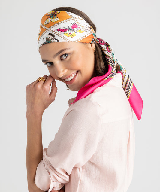 model wearing Butterfly Display Silk Square Scarf in color hibiscus