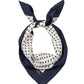 Navy blue and white polka dot scarf on a white background