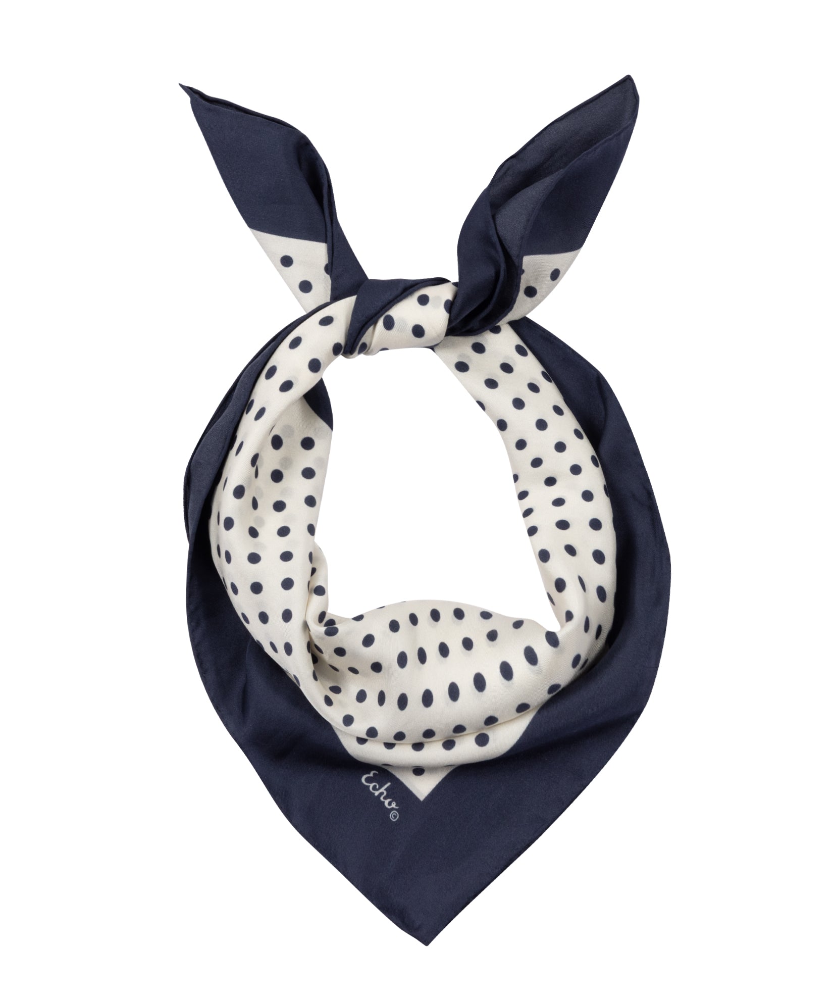 Navy blue and white polka dot scarf on a white background