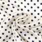 Navy blue square scarf with white polka dot pattern on a white background