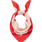 Red and white polka dot scarf on a white background
