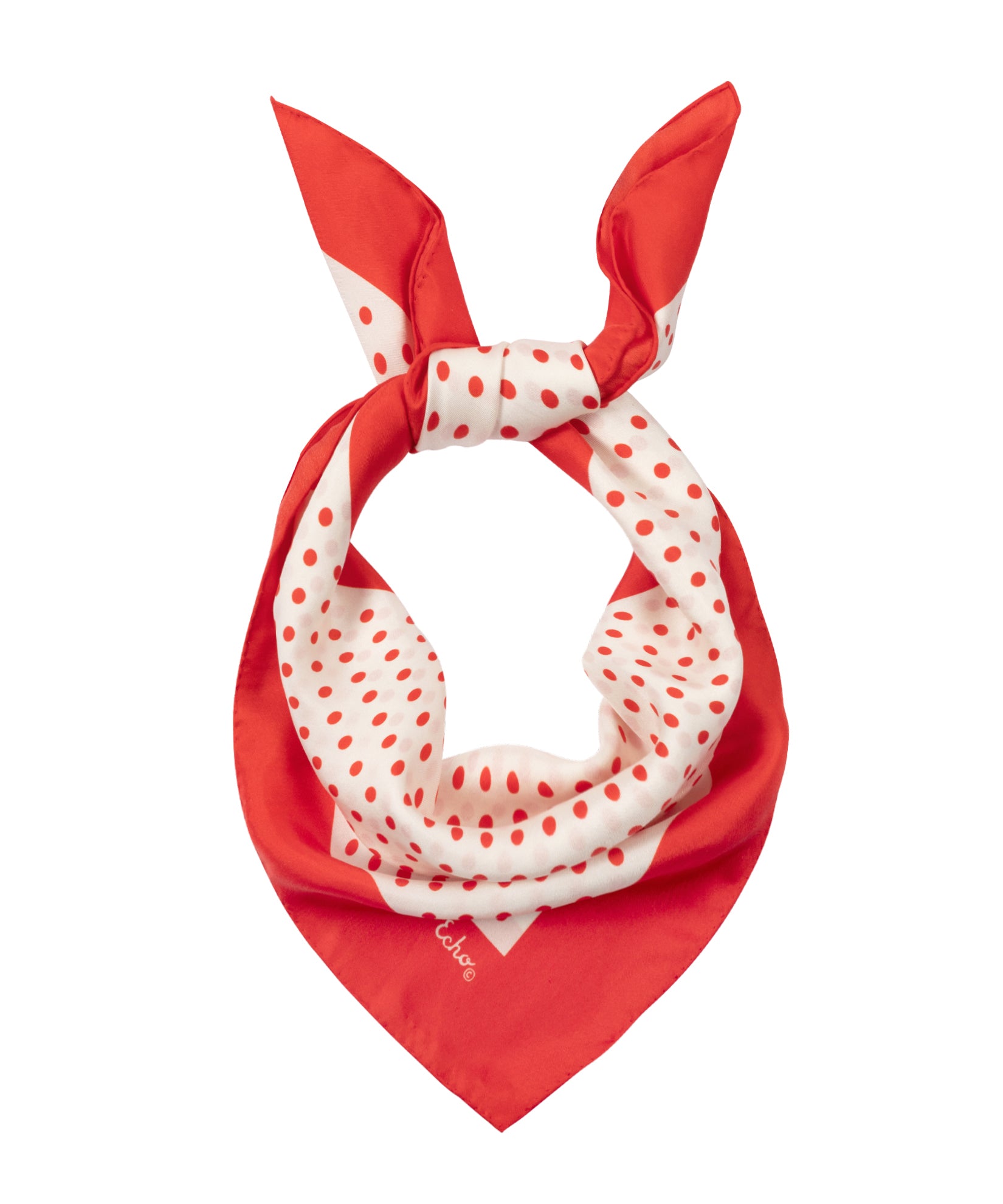 Red and white polka dot scarf on a white background