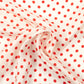 Red and white polka dot scarf on a white background