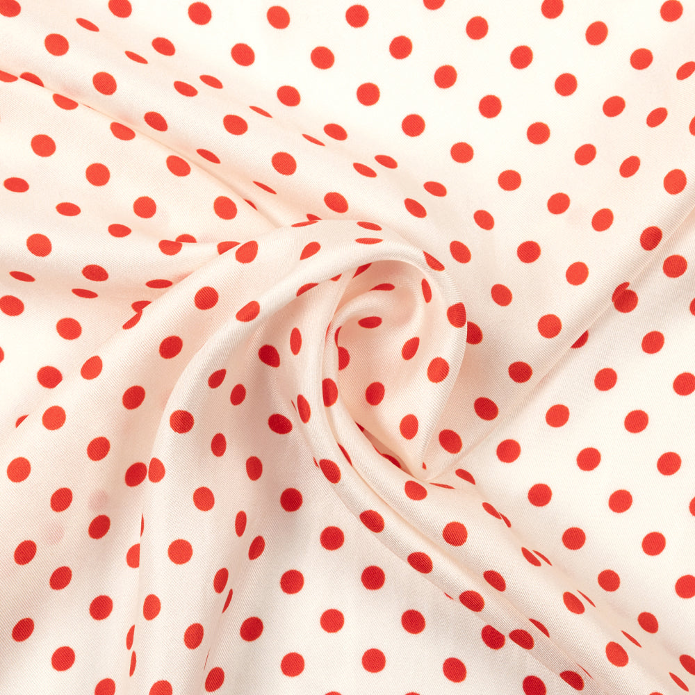 Red and white polka dot scarf on a white background
