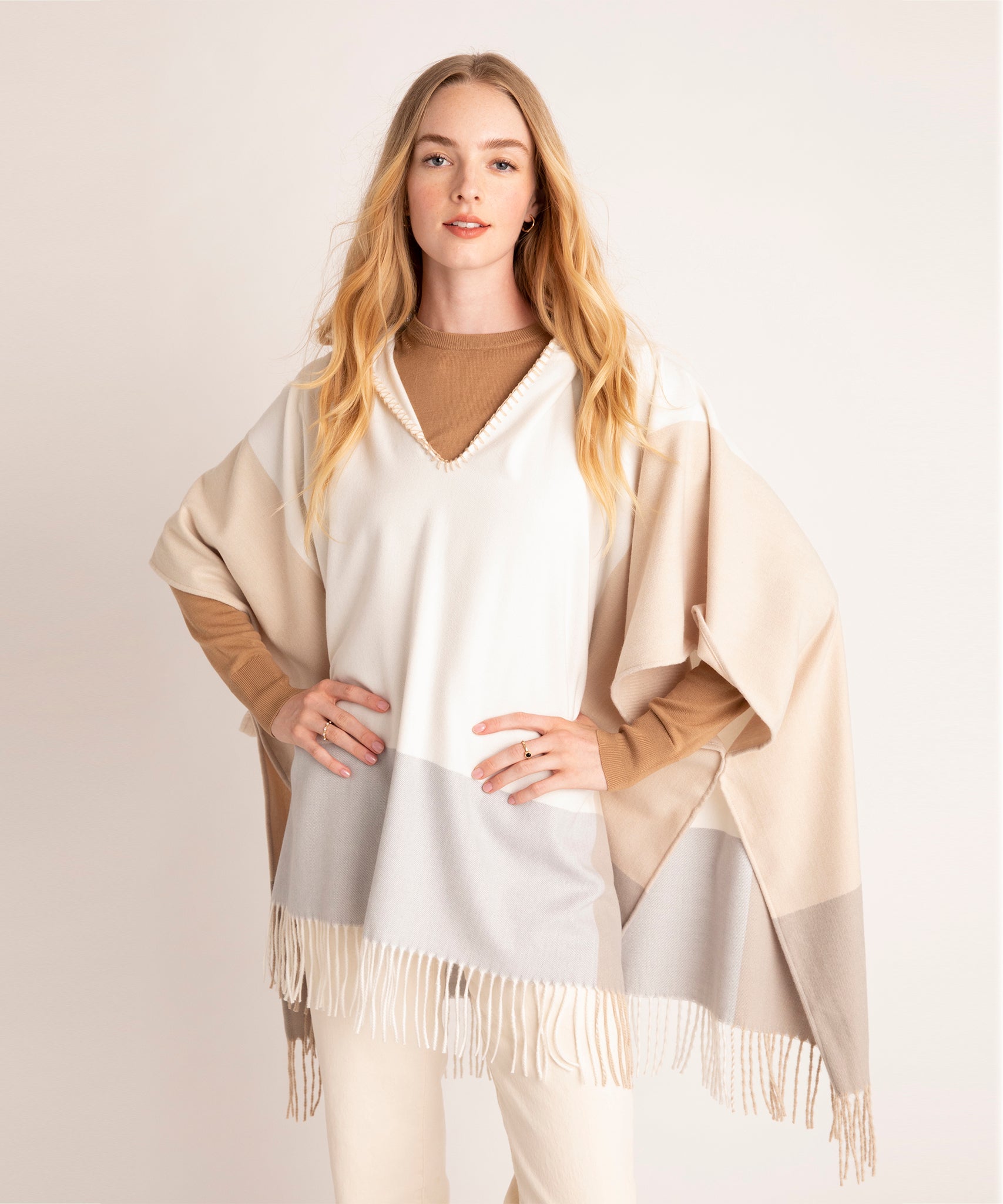 Poet Poncho in color Cream on a model