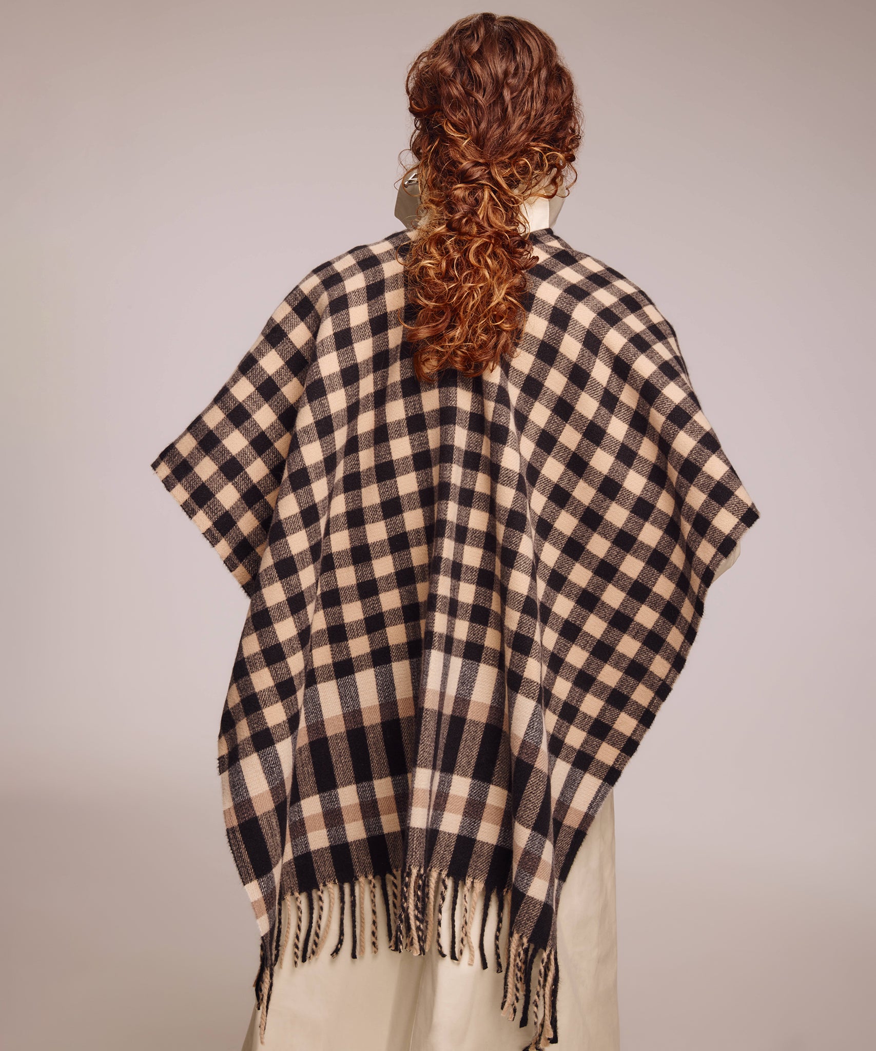 Bordered check ruana in black