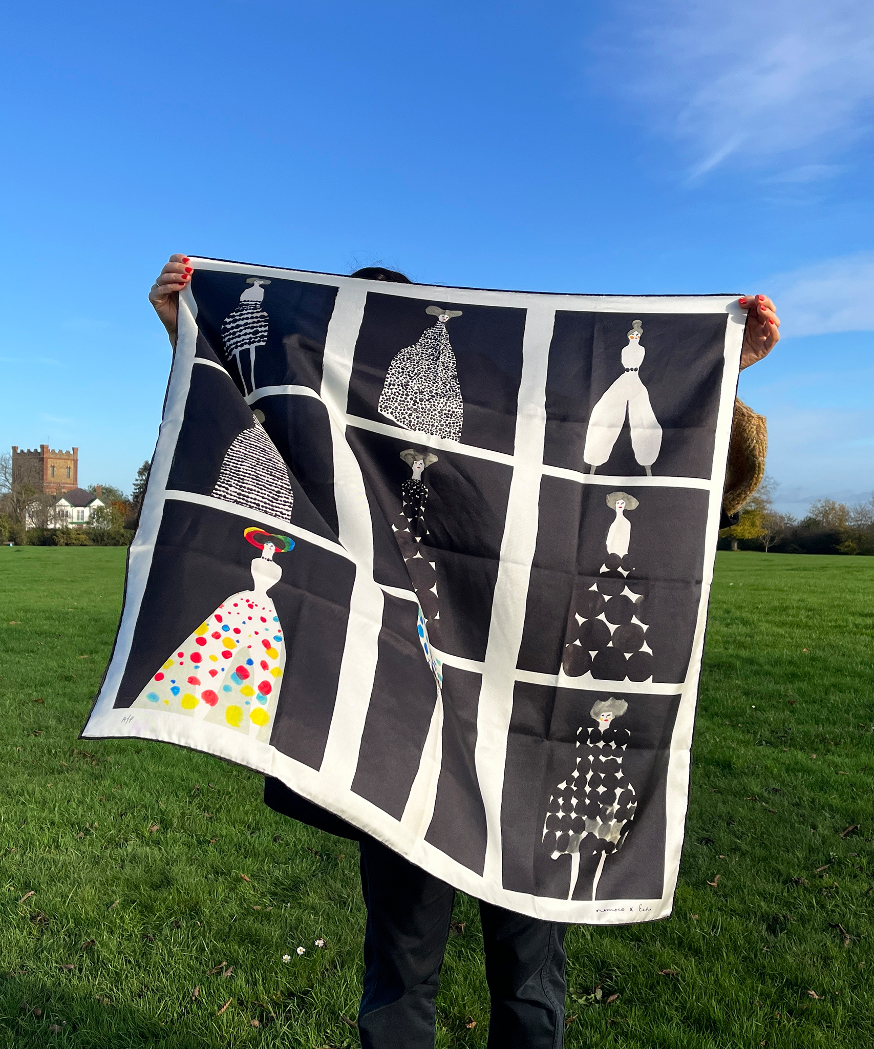 Nomoco holding her echo100 scarf design