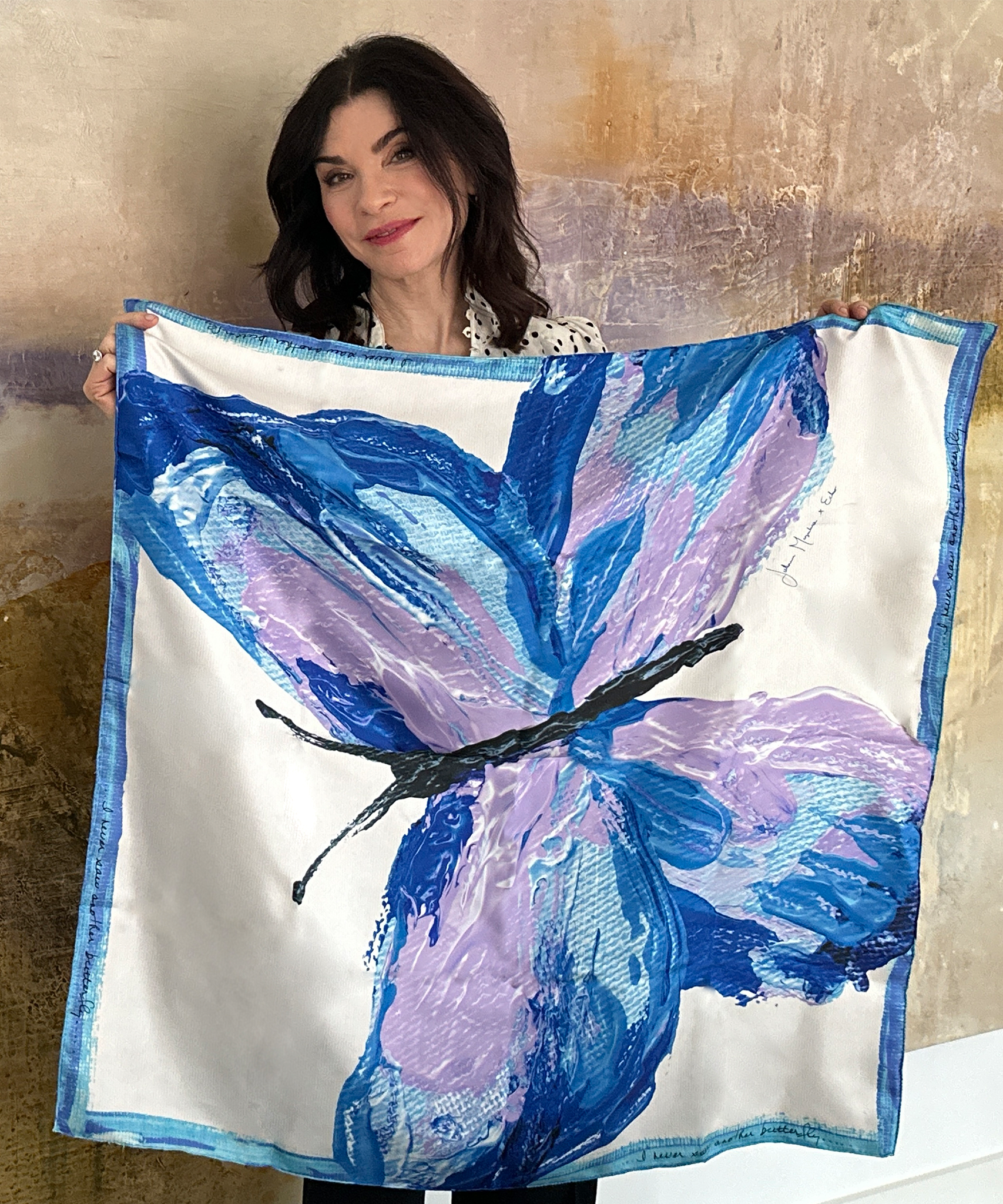 Julianna Margulies holding her scarf design