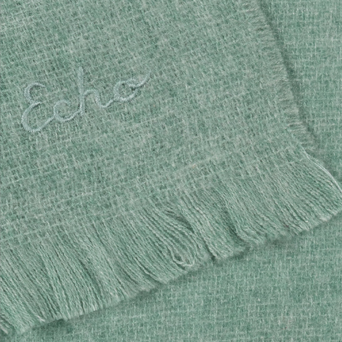 Essential Woven Travel Wrap in color Grey Mist