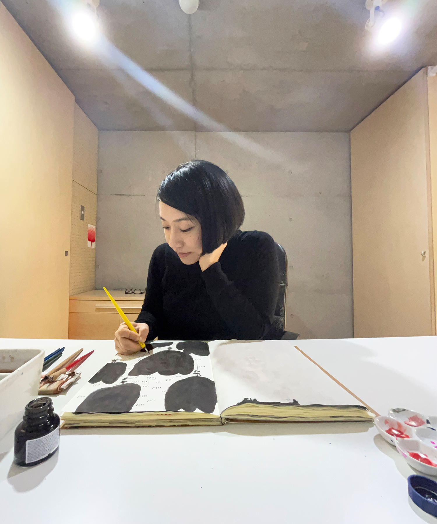 A photograph of illustrator nomoco