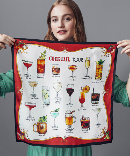 Model holding Cocktail Hour Silk Bandana in color cherry.